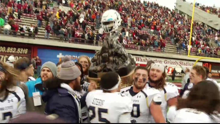 Montana State celebrates with the Great Divide Trophy after defeating Montana 24-17 at Washington-Grizzly Stadium. (MTN Sports photo)